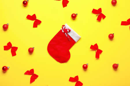 Beautiful Christmas composition with stocking on color backgroundの写真素材