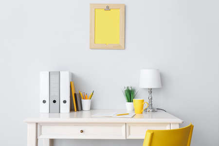 Modern stylish workplace near white wallの写真素材