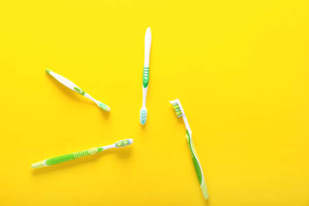 Many tooth brushes on color backgroundの写真素材