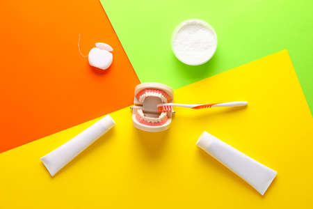 Set for dental hygiene on color background