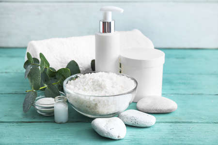 Set of spa supplies on wooden table