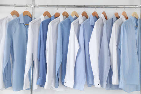 Rack with clothes in modern dry-cleaner'sの写真素材