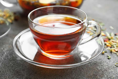 Cup of hot tea on gray backgroundの写真素材