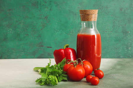 Bottle of fresh vegetable juice on tableの写真素材