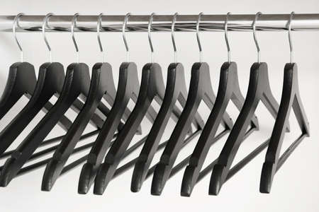 Rack with clothes hangers on white backgroundの写真素材