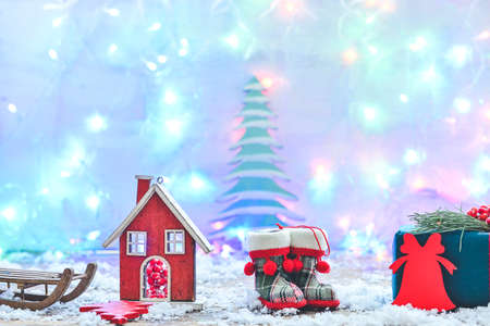 Beautiful Christmas composition with glowing garland on light backgroundの写真素材