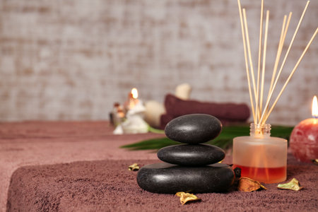 Spa stones with aroma diffuser in beauty salonの写真素材