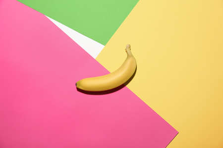 Ripe banana on color backgroundの写真素材