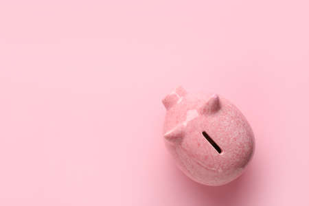 Piggy bank on color backgroundの写真素材