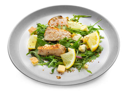 Plate with tasty salad on white backgroundの写真素材