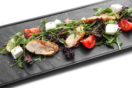 Plate with tasty salad on white background, closeupの写真素材