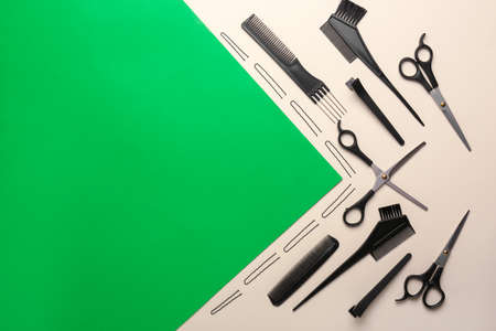 Set of hairdresser tools on color background