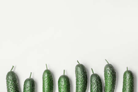 Fresh green cucumbers on light backgroundの写真素材