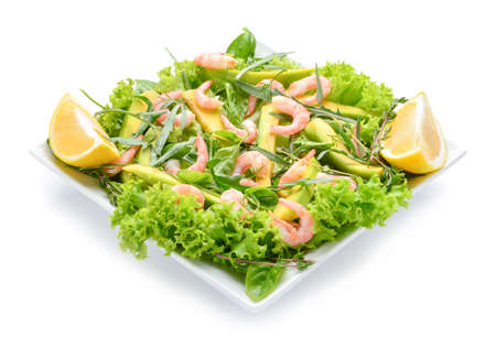 Plate with tasty avocado salad on white backgroundの写真素材