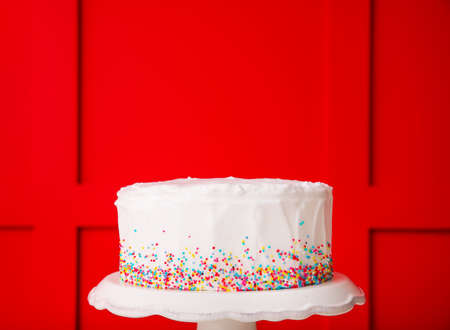 Tasty Birthday cake on color backgroundの写真素材