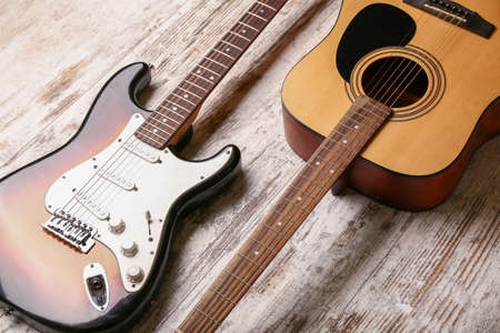 Modern guitars on wooden backgroundの写真素材