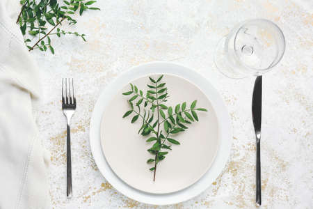 Beautiful table setting with eucalyptus on white backgroundの写真素材