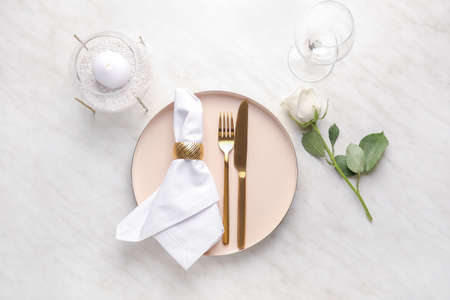 Beautiful table setting on light backgroundの写真素材