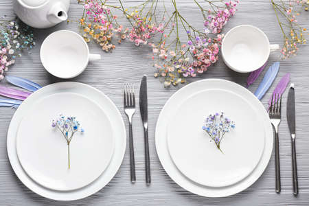 Beautiful table setting on wooden backgroundの写真素材
