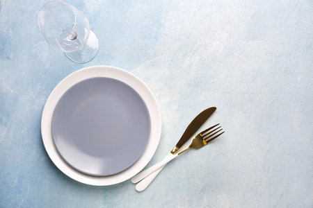 Beautiful table setting on color backgroundの写真素材