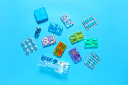 Containers with different pills on color backgroundの写真素材