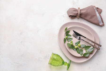 Beautiful table setting on light backgroundの写真素材