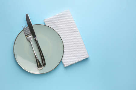 Beautiful table setting on color background