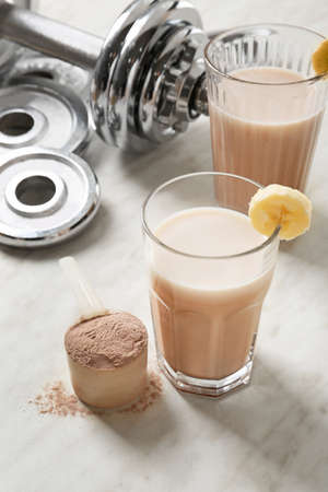 Glasses of protein shake on tableの写真素材