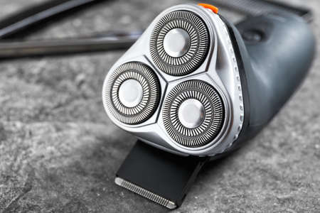 Electric shaver on gray backgroundの写真素材