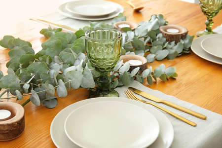 Beautiful table setting with floral decorの写真素材