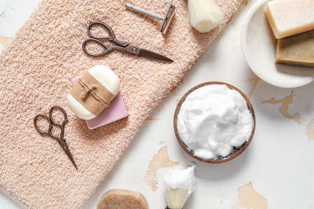 Set for male shaving with towel on light backgroundの写真素材