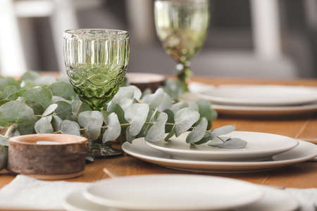 Beautiful table setting with floral decorの写真素材