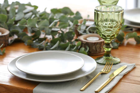 Beautiful table setting with floral decorの写真素材