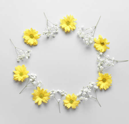 Composition with autumn flowers on white background