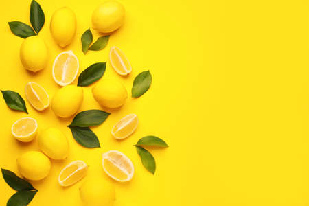 Ripe lemons on color background