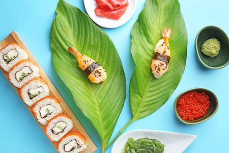 Composition with tasty sushi on color backgroundの写真素材