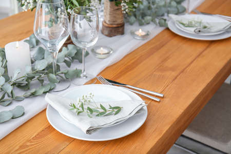 Beautiful table setting for wedding celebration in restaurantの写真素材