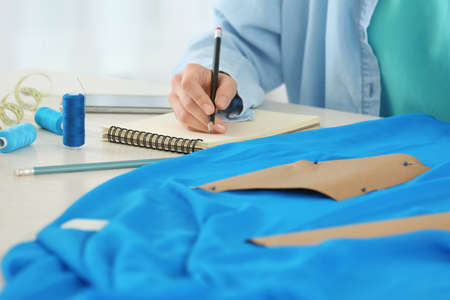 Female designer working in studio, closeup