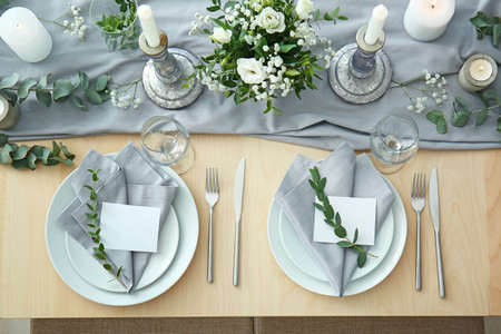 Beautiful table setting for wedding celebration in restaurantの写真素材