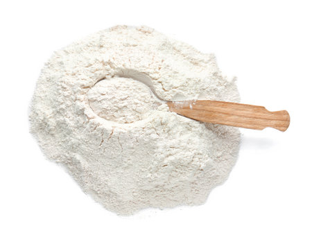 Spoon and flour on white backgroundの写真素材