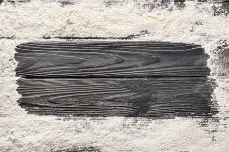 Frame made of flour on wooden backgroundの写真素材