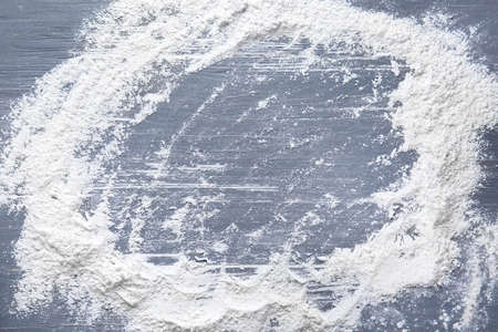 Frame made of flour on wooden backgroundの写真素材