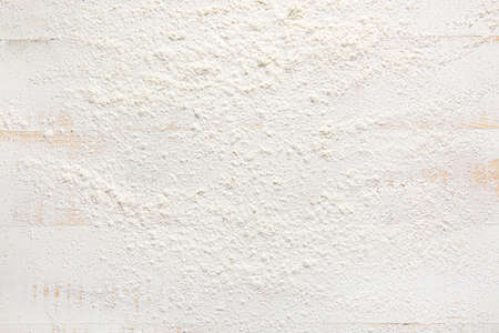 Scattered flour on white background