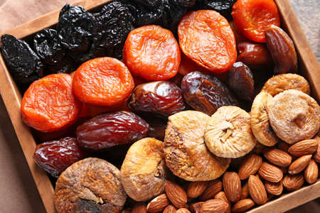 Different dried fruits and nuts in boxの写真素材
