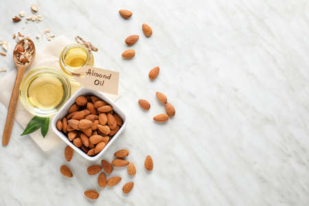 Tasty almond oil on white backgroundの写真素材