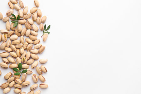 Tasty pistachio nuts on white backgroundの写真素材