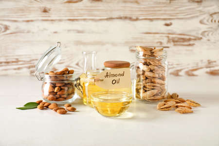 Tasty almond oil on white backgroundの写真素材
