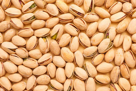 Tasty pistachio nuts as backgroundの写真素材