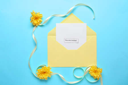 Invitation with envelope on color background