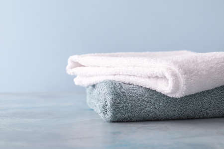Soft clean towels on color backgroundの写真素材